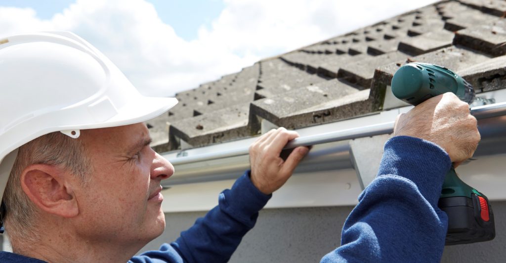 Man Installing Gutter | Gutter Replacement Fairfield CT