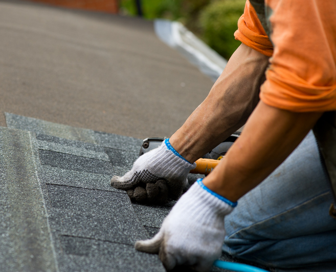 roofer doing work landmark exteriors