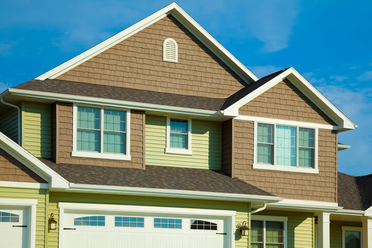 Green and Brown House With Cedar, Vinyl Siding