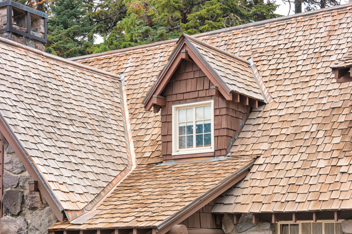 Gable fronted dormer window and wood shingled roof on the Crater Lake National Park Steel visitor center.