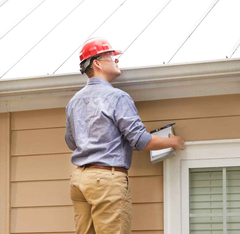 A roof inspector working