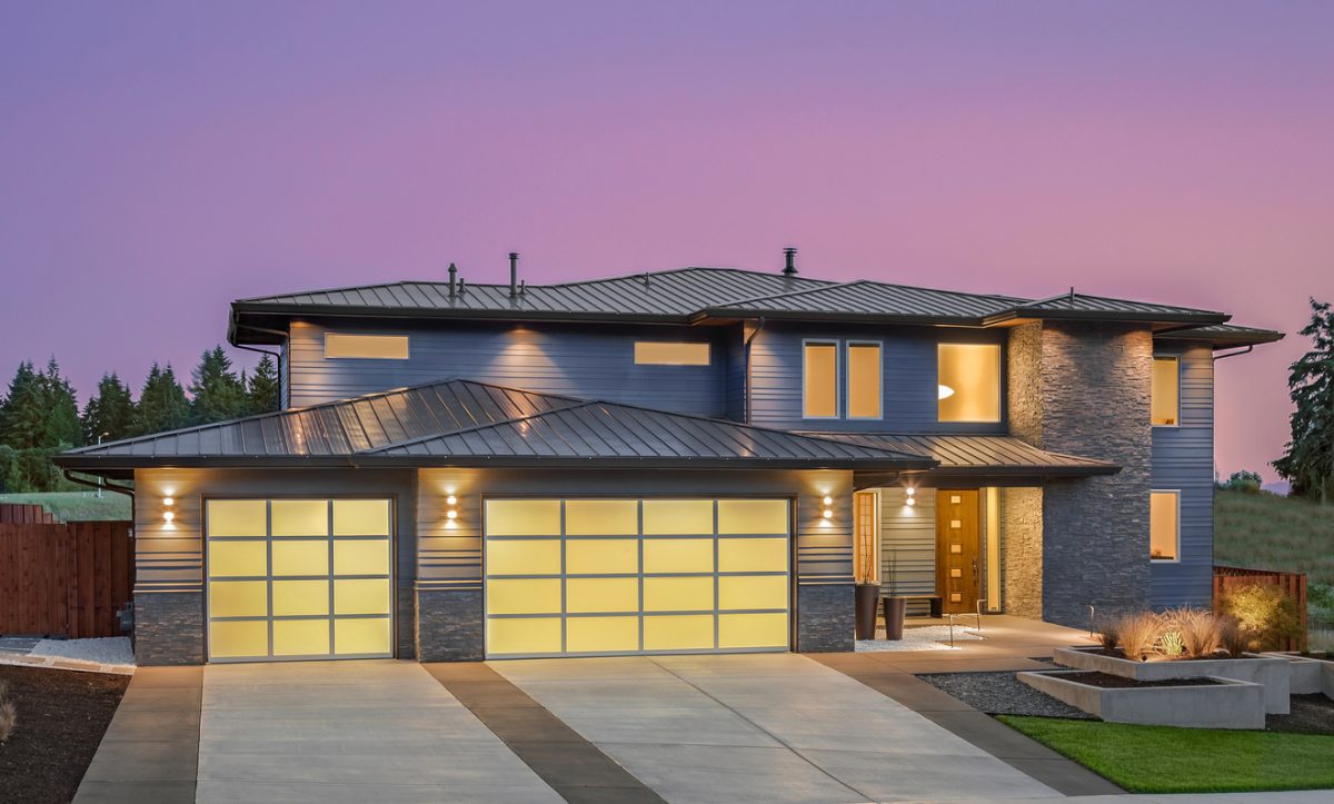 Beautiful exterior of newly constructed luxury home at twilight