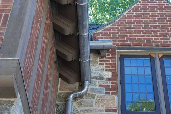 Metal Gutter System on brick house by Landmark Exteriors