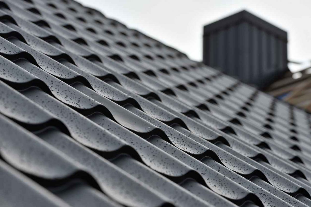 Metal roof with water drops after rain.; metal roof maintenance